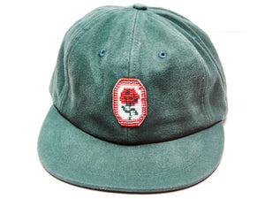 Green Cool Rancher cap with rose pendant 